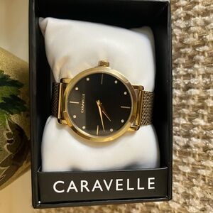 Caravelle watch gold tone with black dial. Brand New in Box.